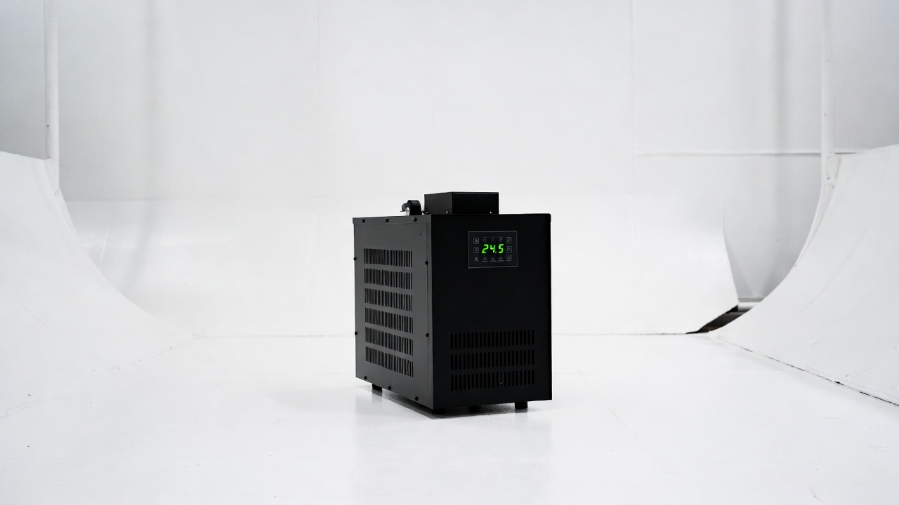 Compact black water chiller unit with green digital temperature display on white background